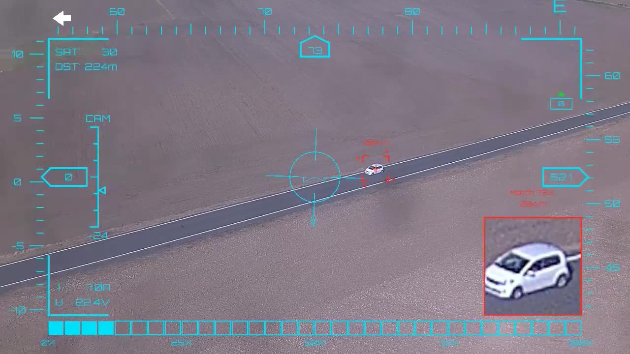 White hatchback through the junction — onboard AI target lock and real-time tracking from a UAV, FPV goggles DVR