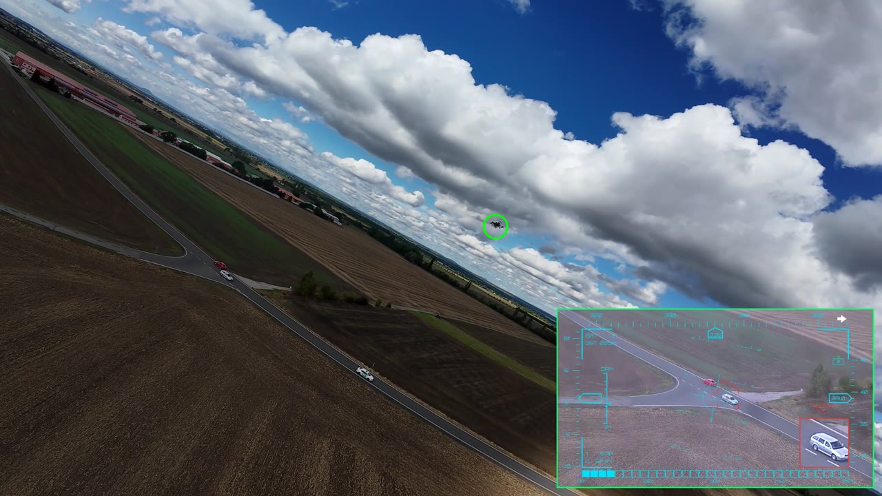 KestrelCV technology demonstrator — carrier drone filmed from a second aircraft, with the frame-synced onboard view showing AI detection and target lock